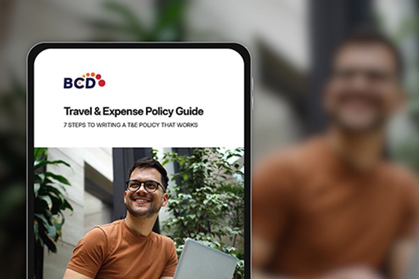 Travel and Expense Policy Guide on tablet screen.